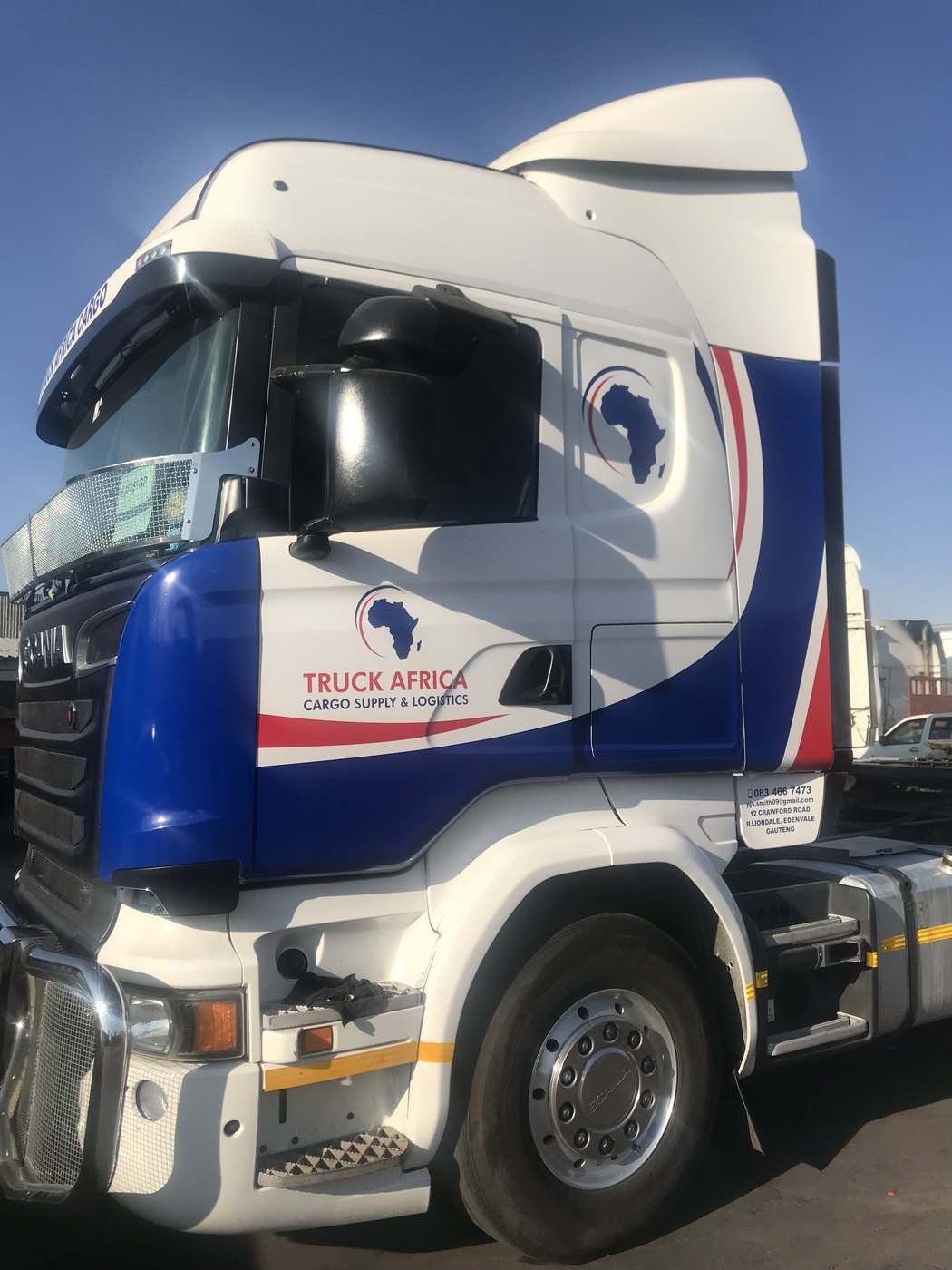 Scania truck cab with compliant reflective marking and fleet livery